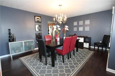 Dark floors and a beautiful wall color show off th