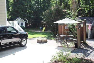Double width concrete drive and patio with firepit