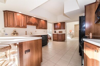 The cherry cabinets give this kitchen a warm and w