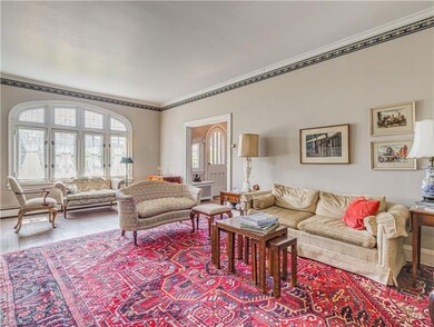 Large living room with casement leaded glass windo