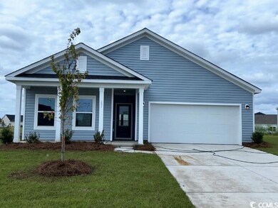 View of front of property featuring a garage and a