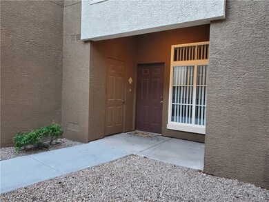 Entrance to property featuring stucco siding