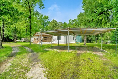 Home has copious parking available - along with a covered carport.