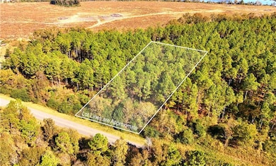 Aerial overview of property's location featuring property boundaries highlighted