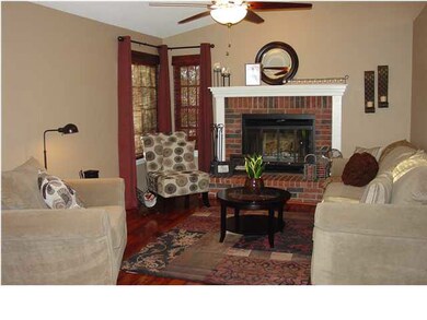 Living room with wood burning fireplace