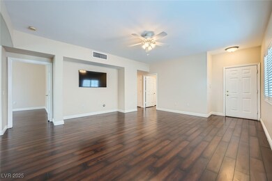 Unfurnished living room with visible vents, basebo