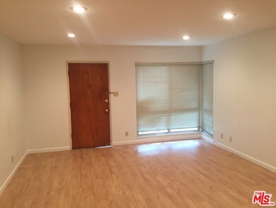 Reverse angle of living room. window faces courtya