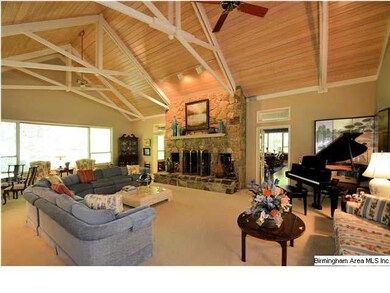 Great room is breath taking with soaring, natural 