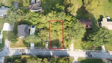 Aerial overview of property's location featuring property parcel outlined