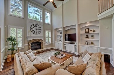Dramatic 2-story Great Room has abundant natural s