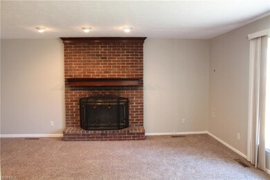 family room natural wood burning brick fireplace, 