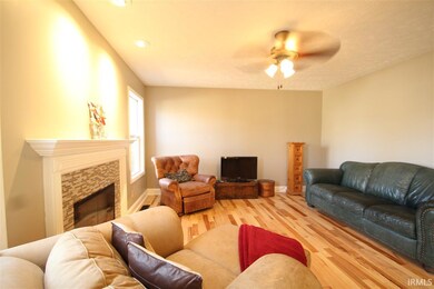 Gas log fireplace. Windows that over look the wood