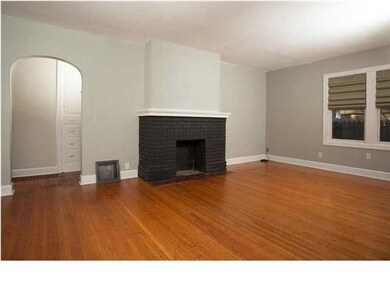 Inviting Living Room with decorative fireplace and