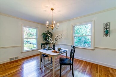 Smooth ceilings, crown and chair rail complement the Dining Room