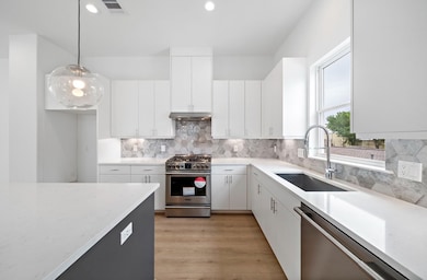 Quartz countertops, designer tile and soft close s