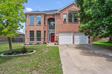 View of front of house with driveway, an attached
