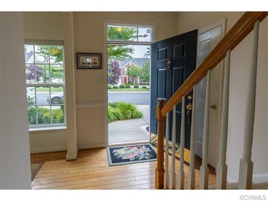 Hardwood floors in the foyer and lots of windows t