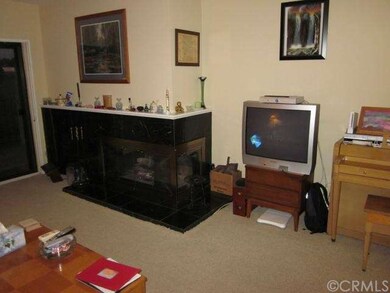 Another view of living area including the fireplac