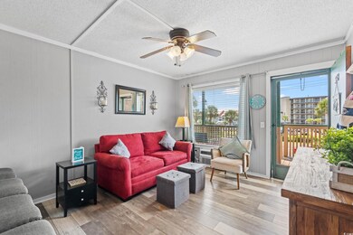 Living room featuring a textured ceiling, ceiling 