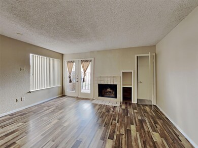 Unfurnished living room with wood-type flooring, a