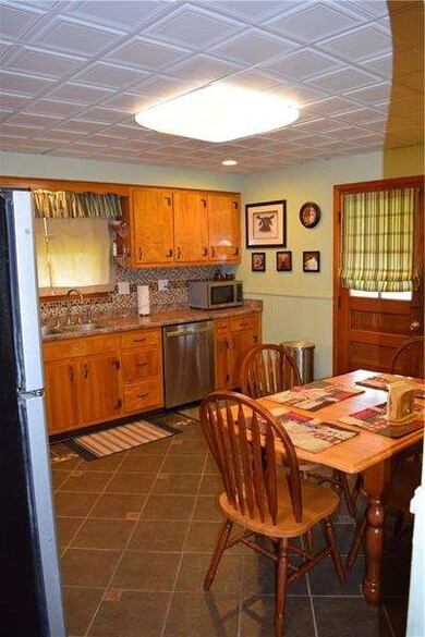 Updated eat in kitchen with ceramic tile flooring 