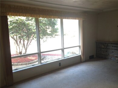 The large windows in the living room will help you