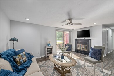 Living room with dark hardwood / wood-style floori