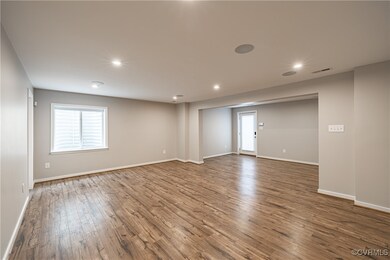 Empty room featuring wood-type flooring