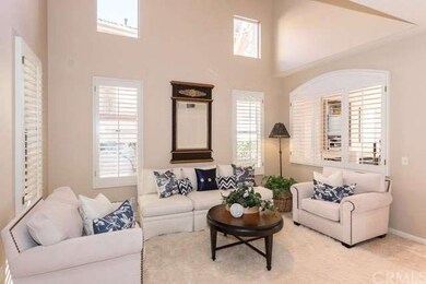Beautiful living room with plantation shutters, ma