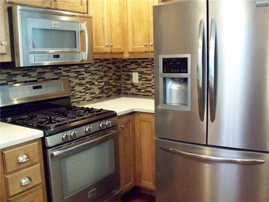 Remodeled kitchen with stainless appliances and a 
