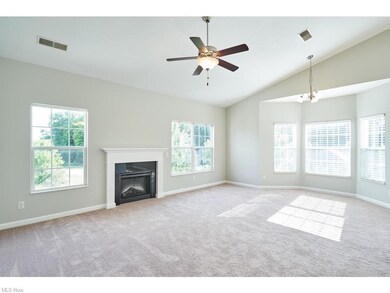 Gas fireplace in the great room into a sunny bayed