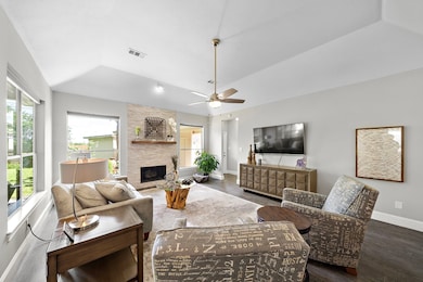 This inviting living room features a cozy fireplac