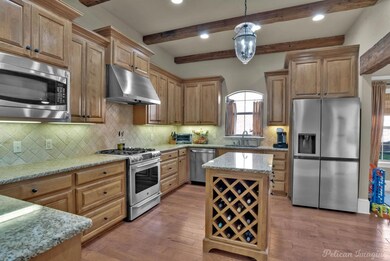 Kitchen featuring a sink, light wood-style floors,