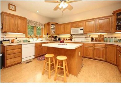 Kitchen is spacious with plenty of cabinet space!