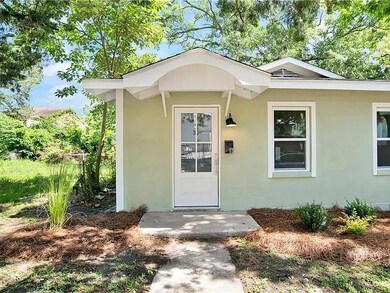 Entrance to property featuring stucco siding