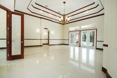 Formal Living with Marble Floors and Crown Molding