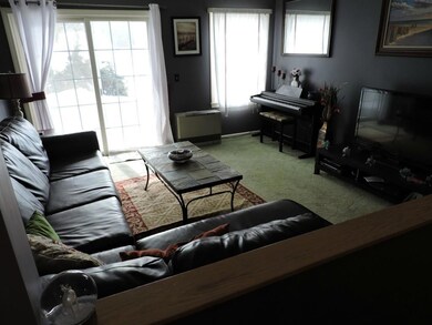 Spacious Living Room with Sliders to...