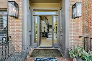 Doorway to property with brick siding