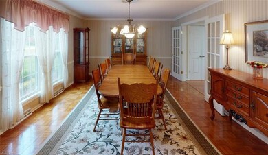 Living room with French doors to kitchen. It's cur