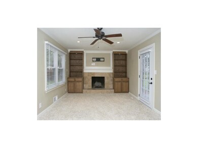 Cozy fireplace with built-in bookshelves in your f