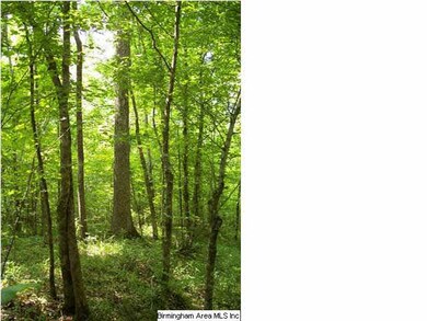 Heavily wooded area with hardwoods that provides e