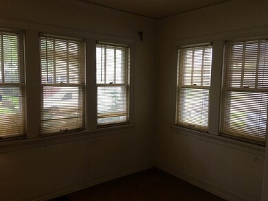 Sun parlor with french doors into living room.