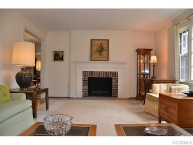 The living room has one of two wood burning firepl
