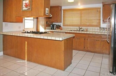 Sunlit Kitchen with Tile Countertop, Breakfast Bar