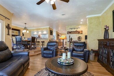 Living area with wood finished floors, a ceiling 