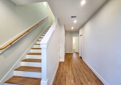 This photo showcases a bright and modern hallway w