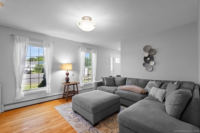 The living area is bright and welcoming... hardwood floors throughout.