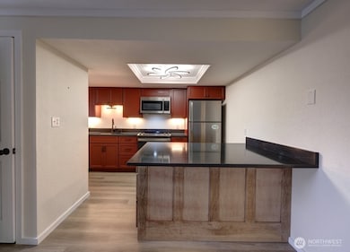 Completely remodeled kitchen with new lighting, flooring, cabinets, counter tops, appliances, fixtures and paint.