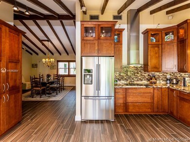PARTIAL VIEW OF THE KITCHEN AND DINING ROOM