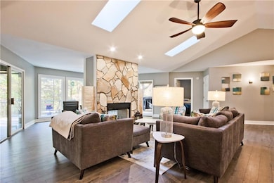The stone wood burning fireplace is a beautiful ce